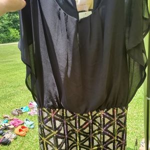 Black  dress with gold and black sequins on the bottom